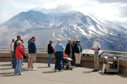 Tyson Rasor of the Mount St. Helens Institute discusses the volcano’s eruption in 1980 to visitors at the Johnston Ridge Observatory on May 18, 2007. With winter snows now melting, Johnston Ridge will host Bill Nye, The Science Guy, on Saturday, May 16, for those with tickets only. The observatory officially opens to the public on Sunday, May 17.